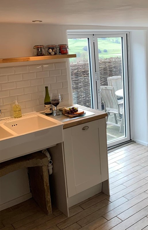 Kitchen with bifold doors with views Hope Valley